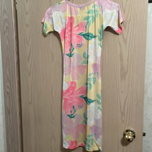 Love McNicoll pretty pastel coloured dress with a peach long camisole underneath - Picture 2 of 7